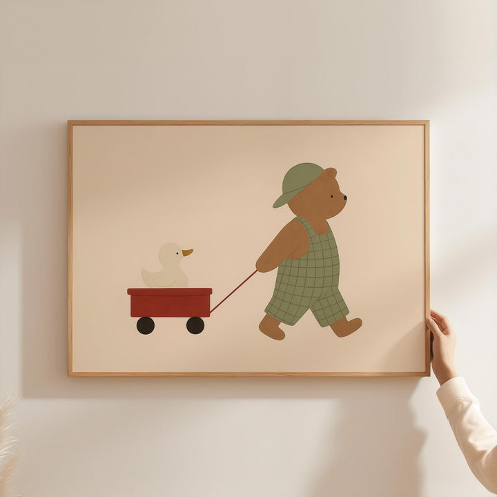 a person holding a picture of a teddy bear pulling a wagon