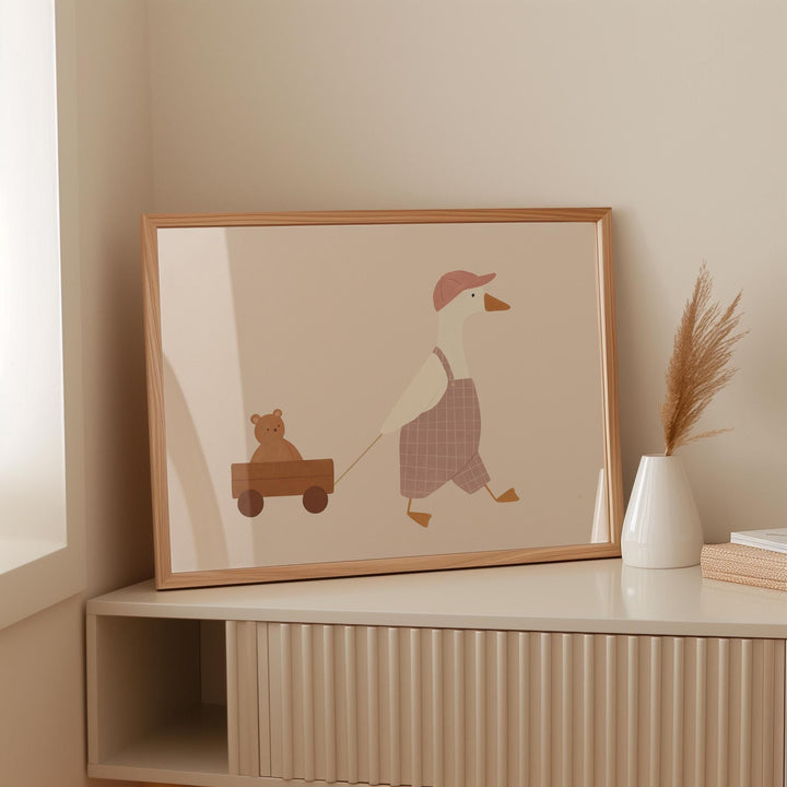 a picture of a duck pulling a bear on a wagon
