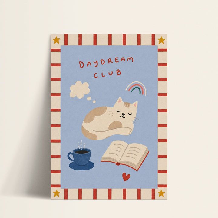 Daydream Club sleeping cat print shown as a matte paper art print
