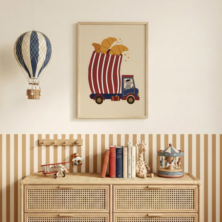 a wooden dresser with a framed picture of a hot air balloon carrying a basket of bread, a toy airplane, and a carousel. The dresser also has a collection of books and toys on top.