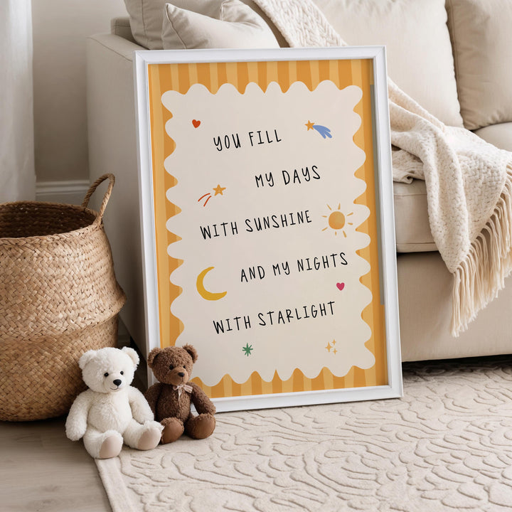 a teddy bear sitting next to a picture frame