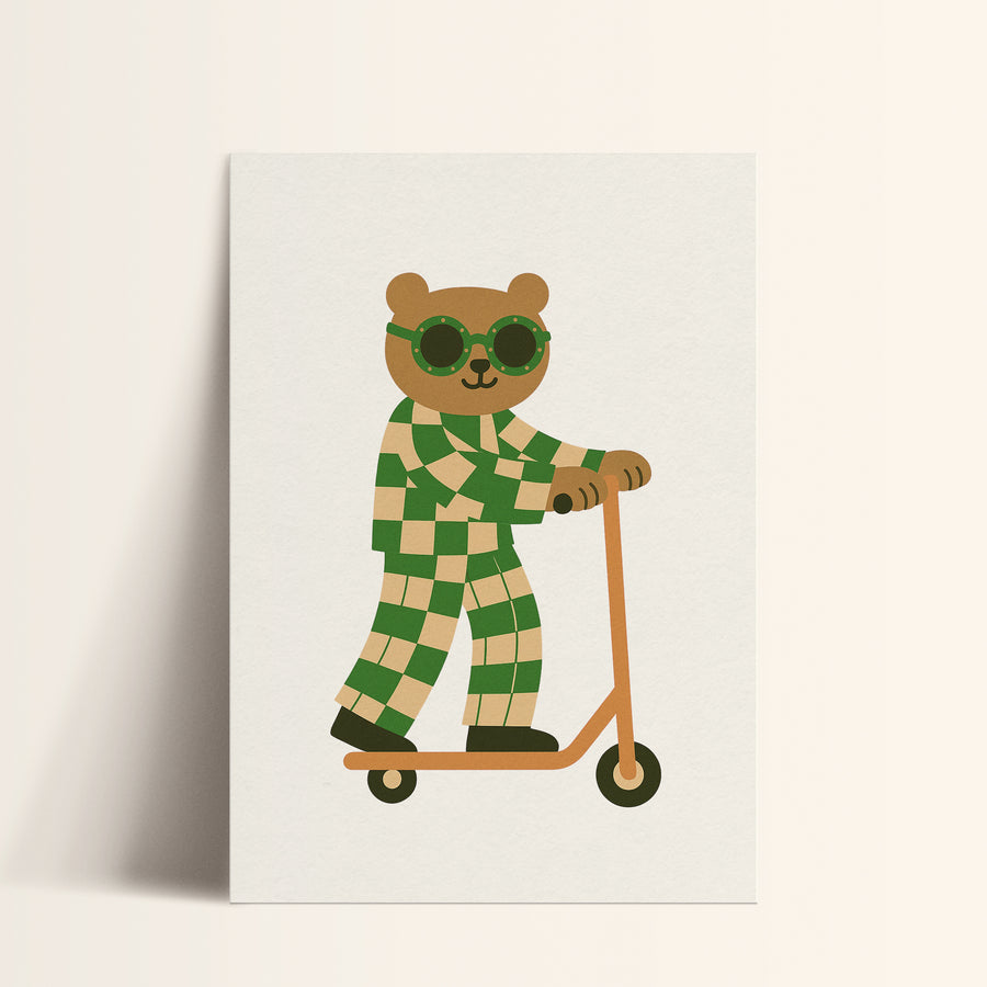 a card with a teddy bear riding a scooter