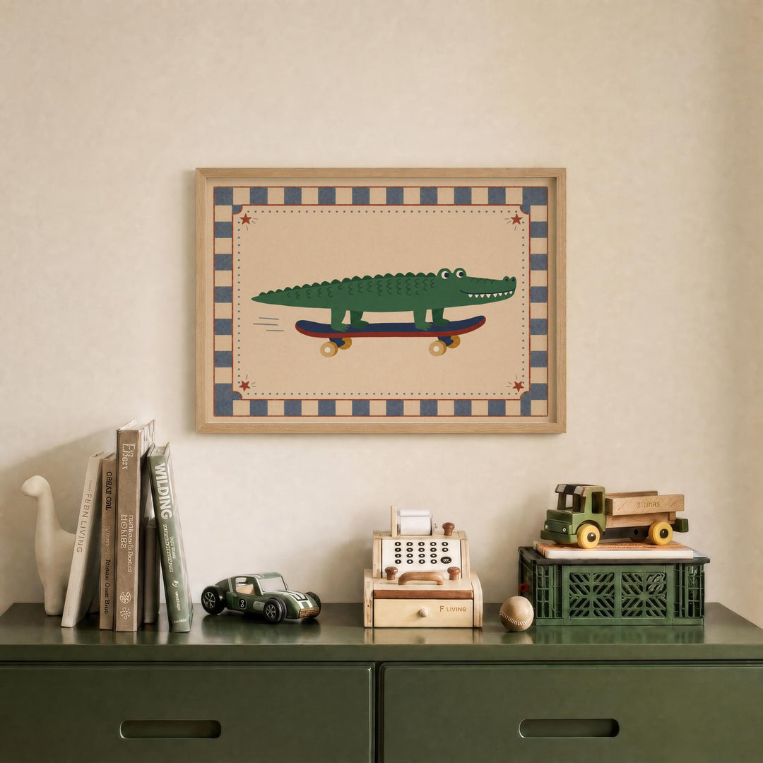a framed picture of a green alligator on a skateboard, displayed on a wall above a green dresser with various toys and books on it.
