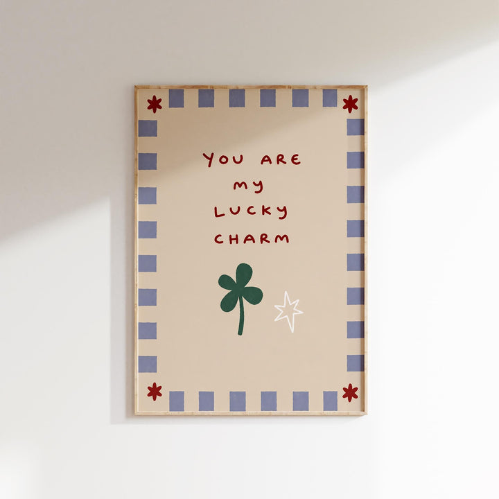 The image is a framed piece of art with a message that reads "You are my lucky charm".