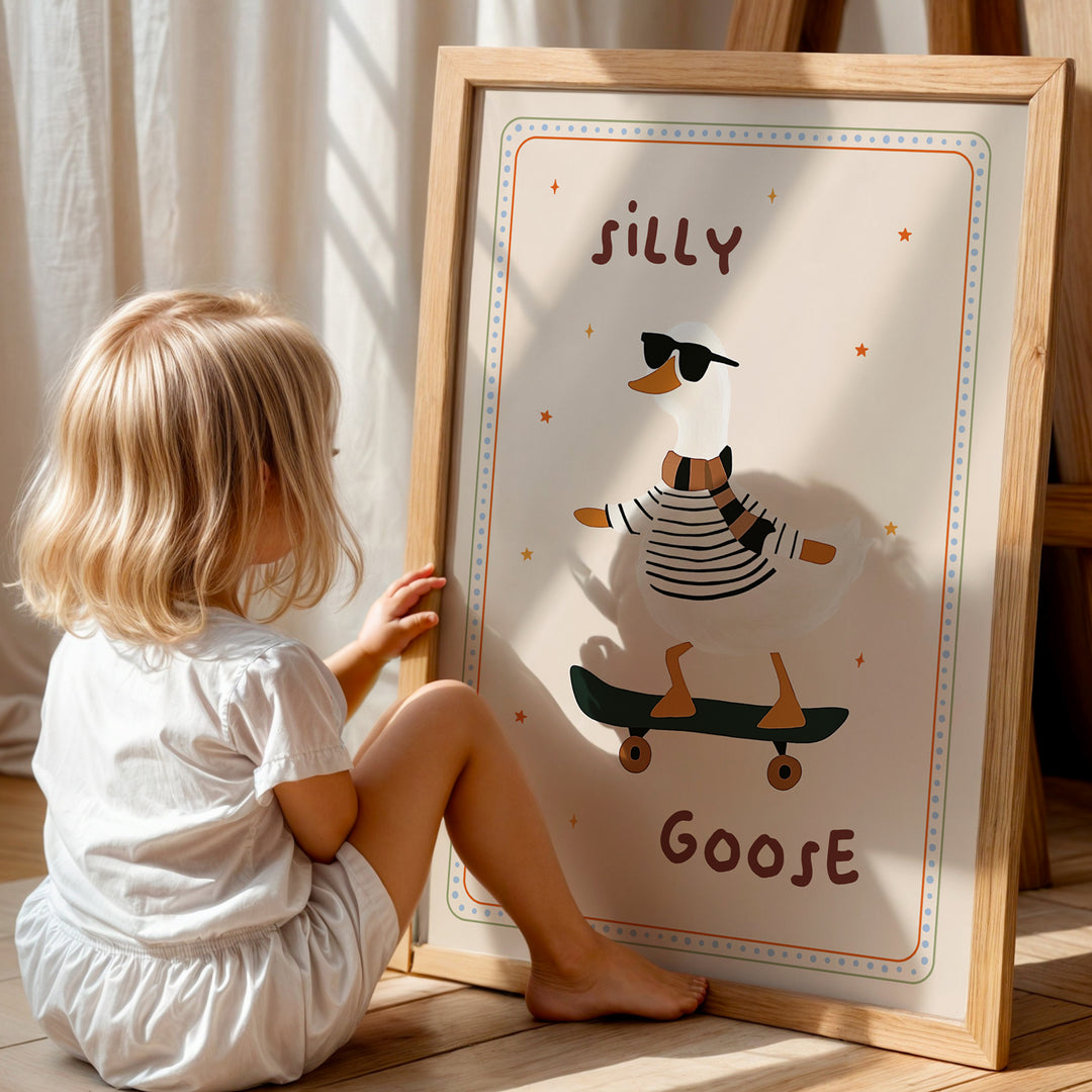 a little girl sitting on the floor next to a poster