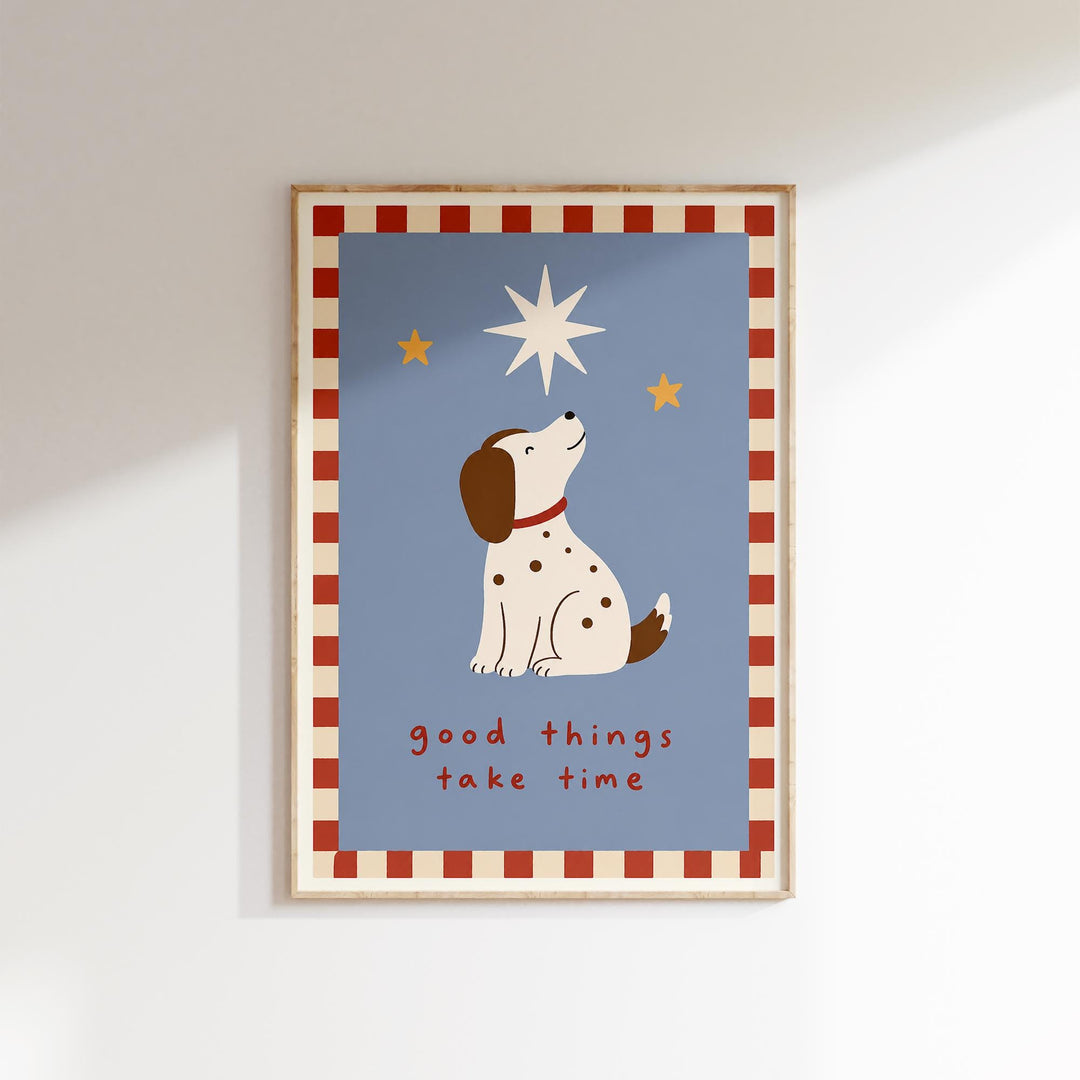 A framed poster with a cartoon dog looking up at the stars, accompanied by the text "Good things take time".