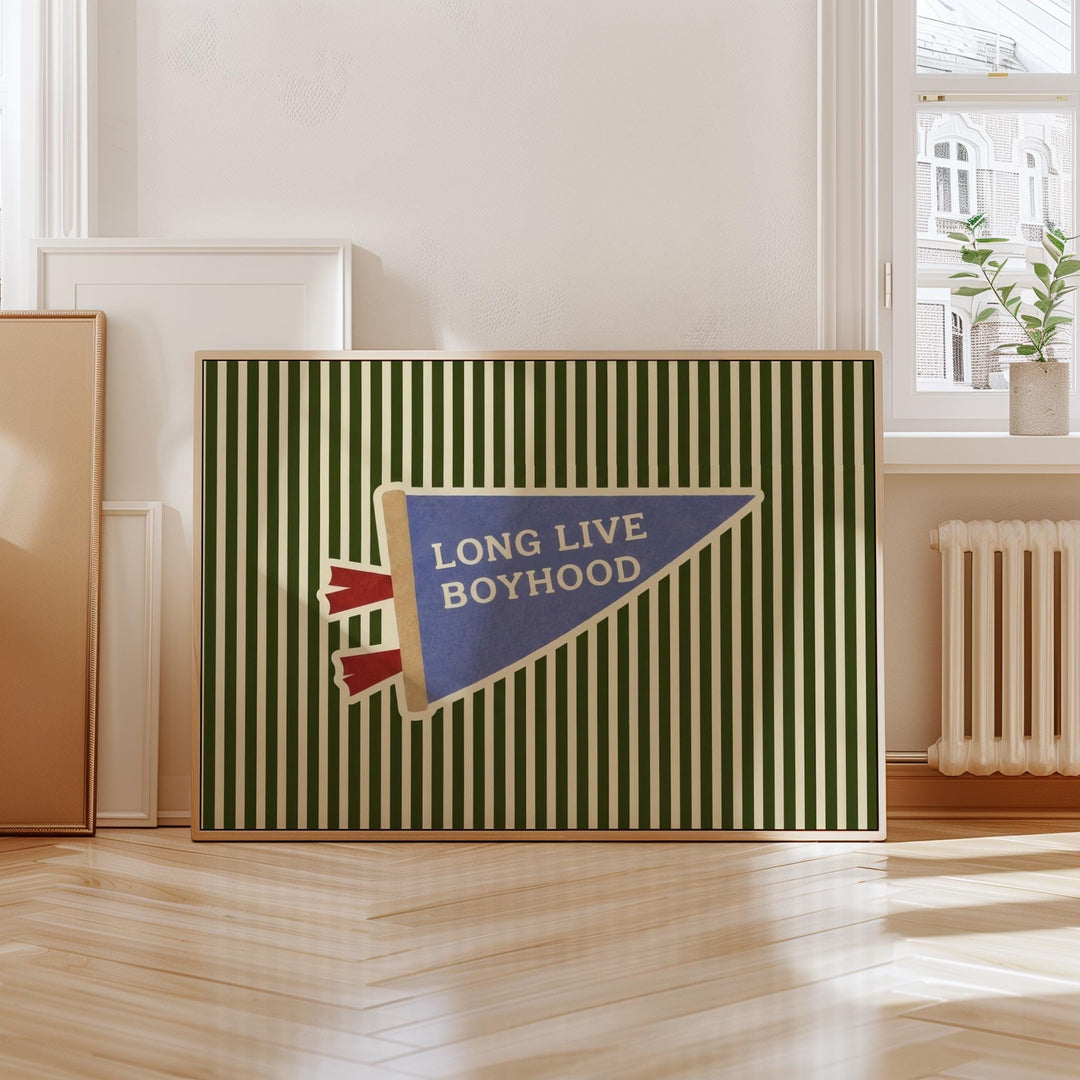 a framed poster with a green and white striped background and a blue and white triangular banner with the text "LONG LIVE BOYHOOD" on it.