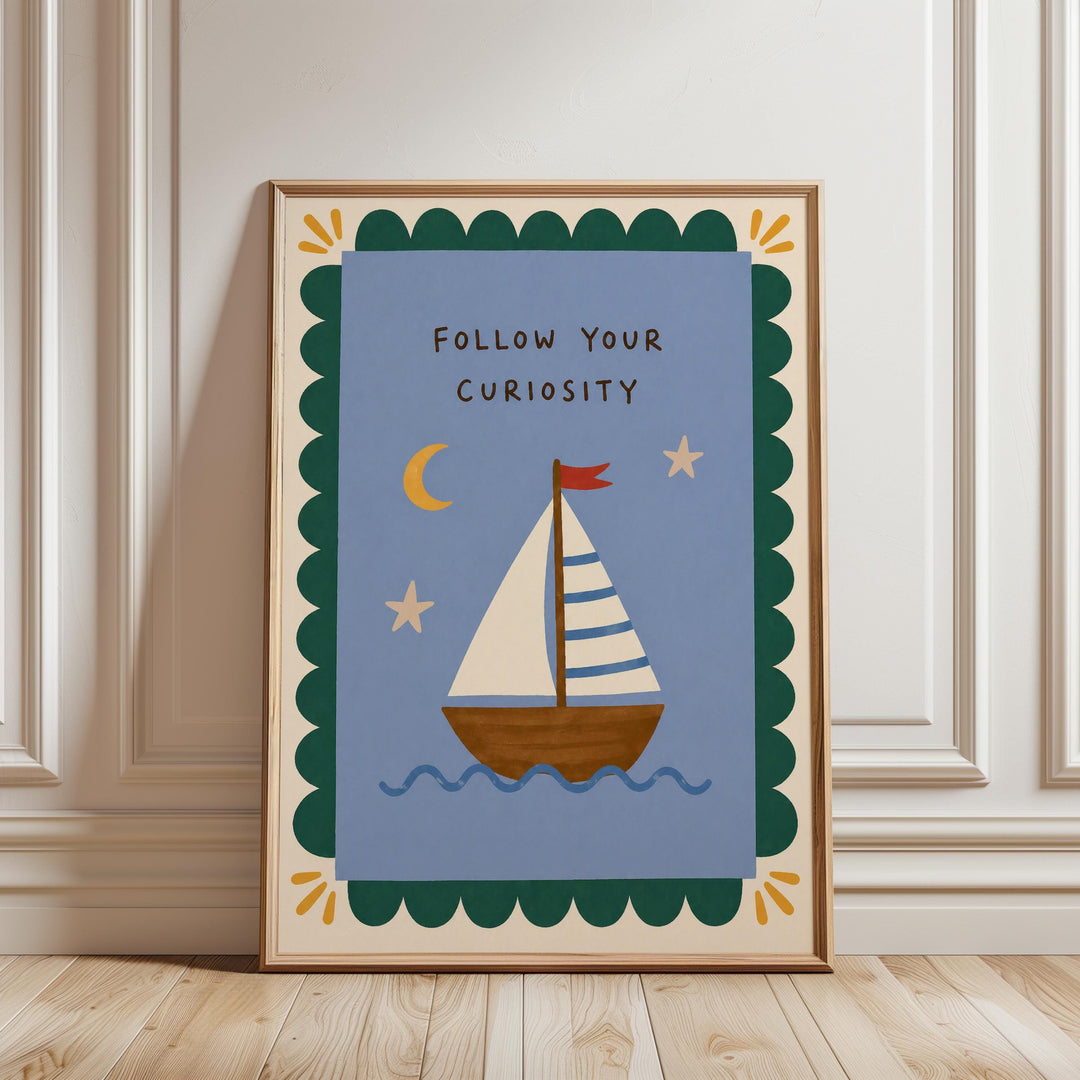 a framed poster with a sailboat illustration and the text "Follow Your Curiosity" on it.