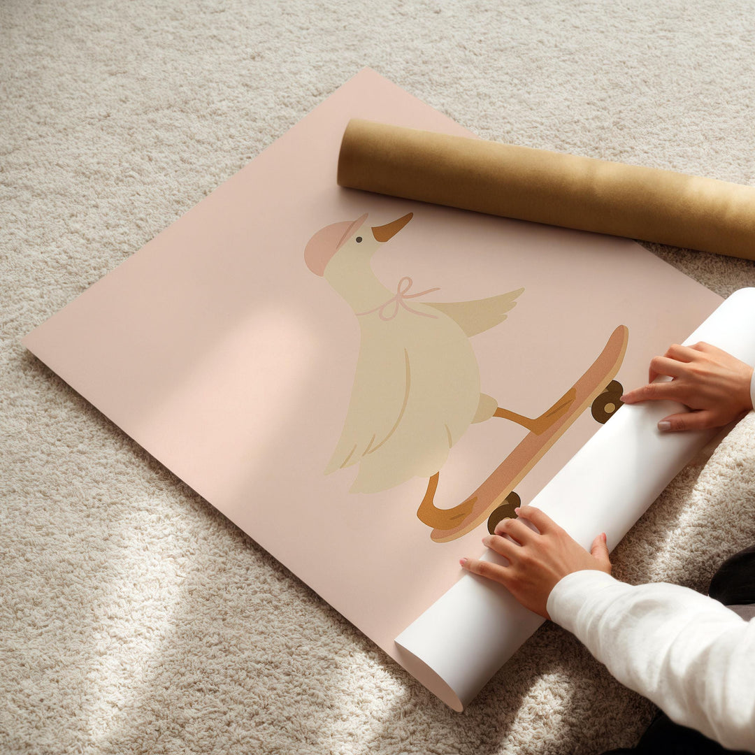 a person holding a roll of paper with a picture of a bird on it