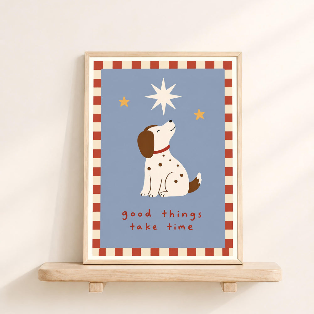 A framed illustration of a dog looking up at the stars, with the text "good things take time" below the image.
