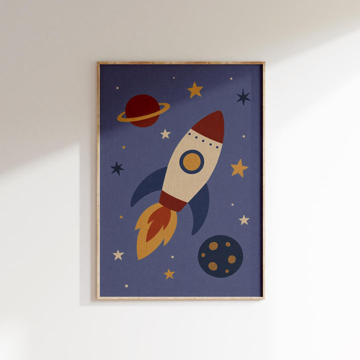 The image is a framed artwork depicting a rocket ship soaring through a starry night sky, with a planet visible in the background.