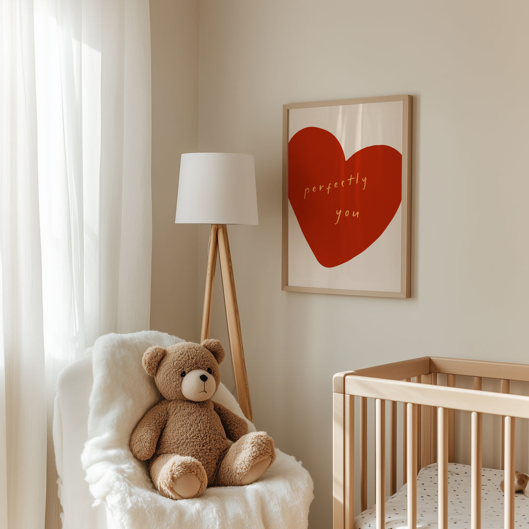 a teddy bear sitting in a chair next to a crib