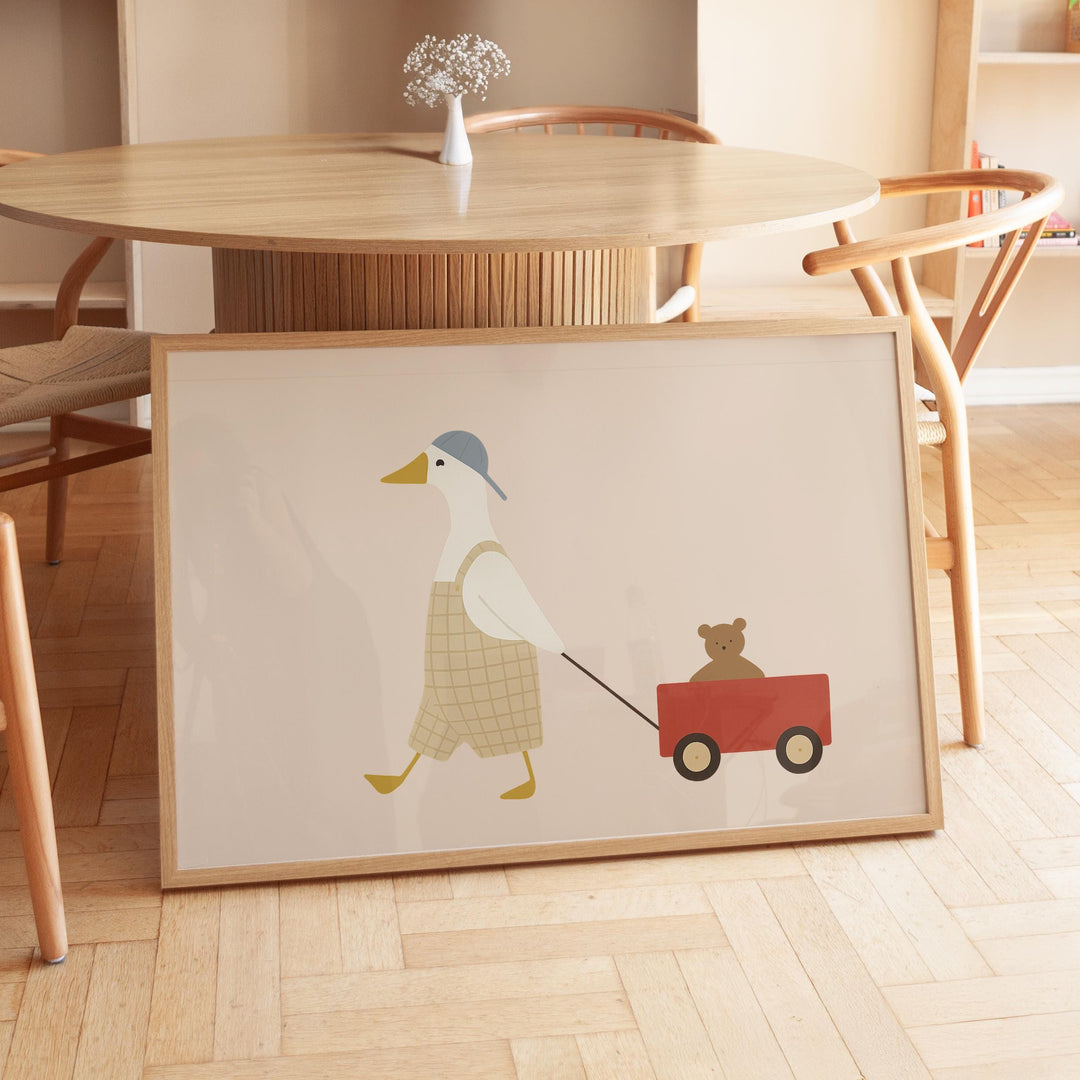 a picture of a duck pulling a bear on a wagon