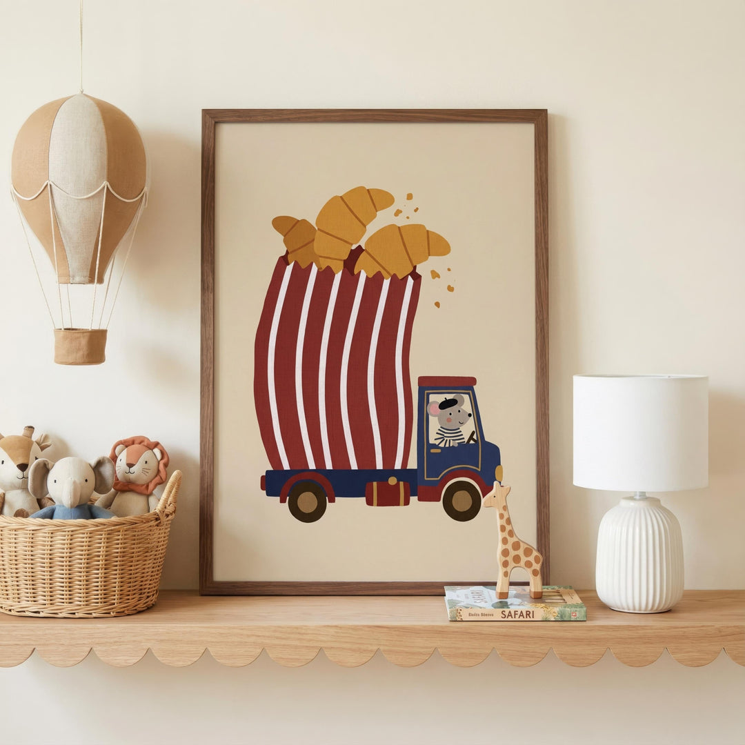 a wooden shelf with a framed illustration of a red and white striped truck carrying a basket of croissants, a toy giraffe, and a toy lion. There is also a hot air balloon and a lamp on the shelf.
