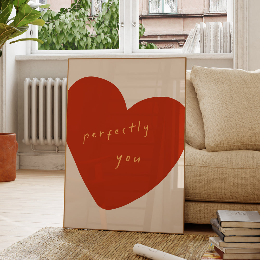 a picture frame with a red heart on it