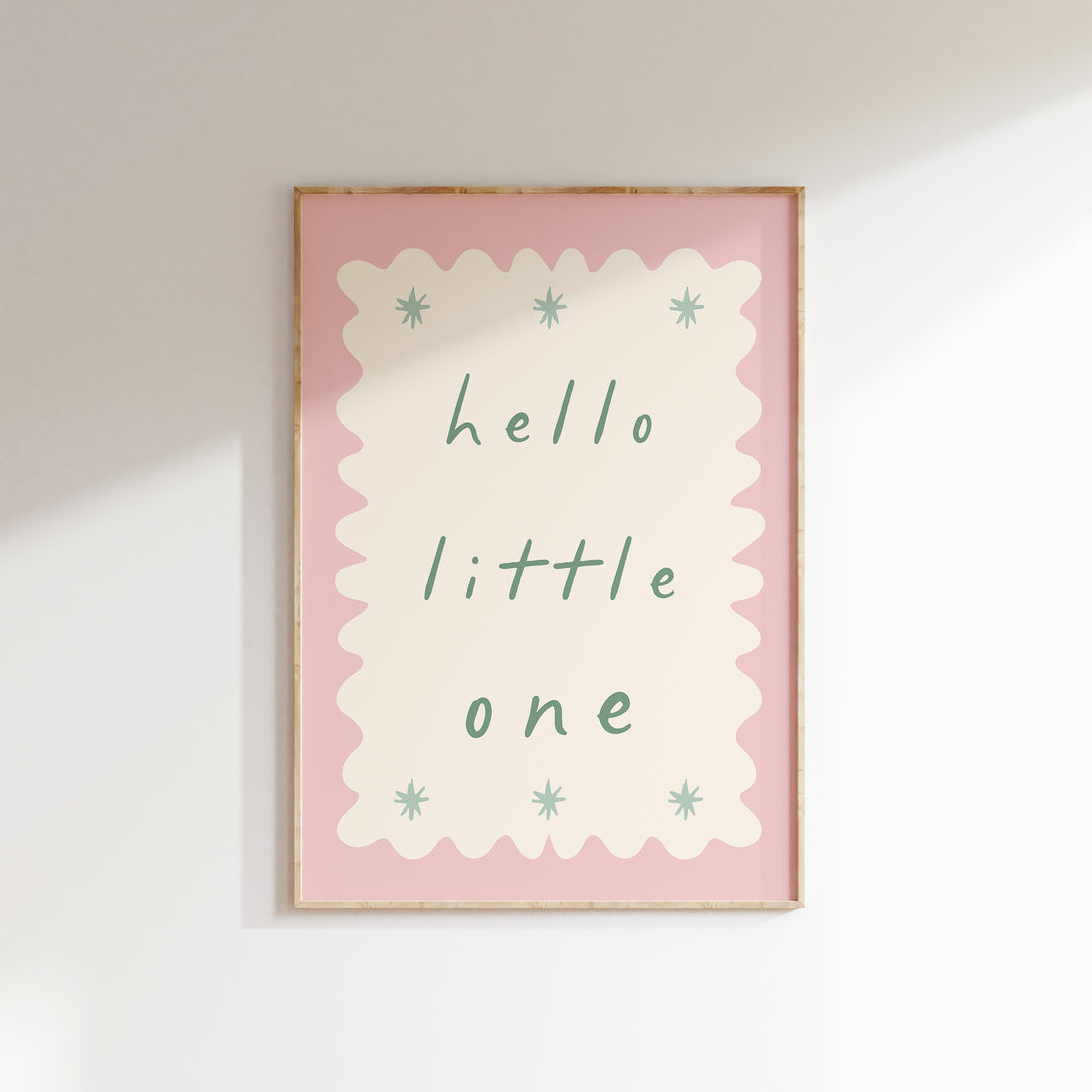 a picture of a hello little one hanging on a wall