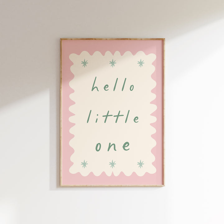 a picture of a hello little one hanging on a wall