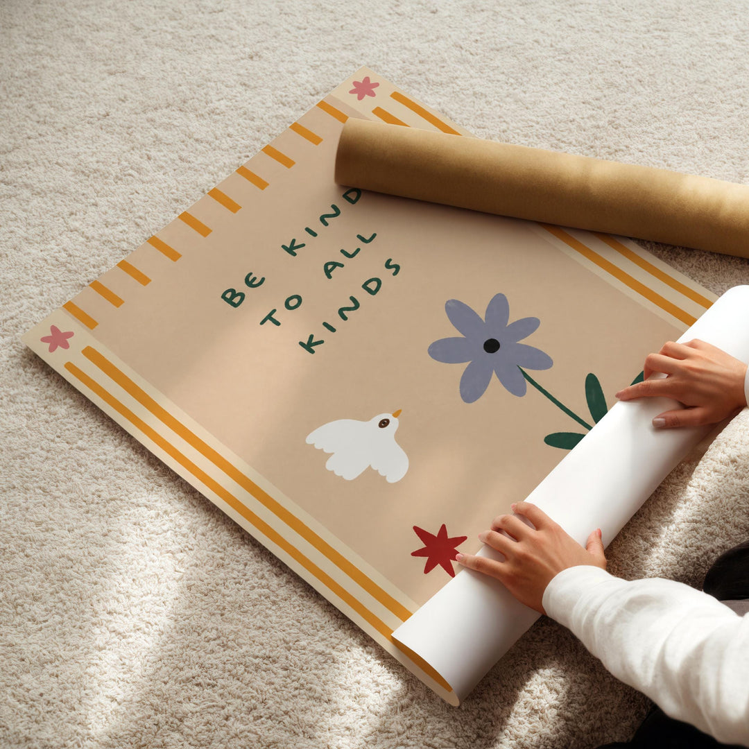 A child's hands are rolling up a poster with a message about being kind to all kinds.