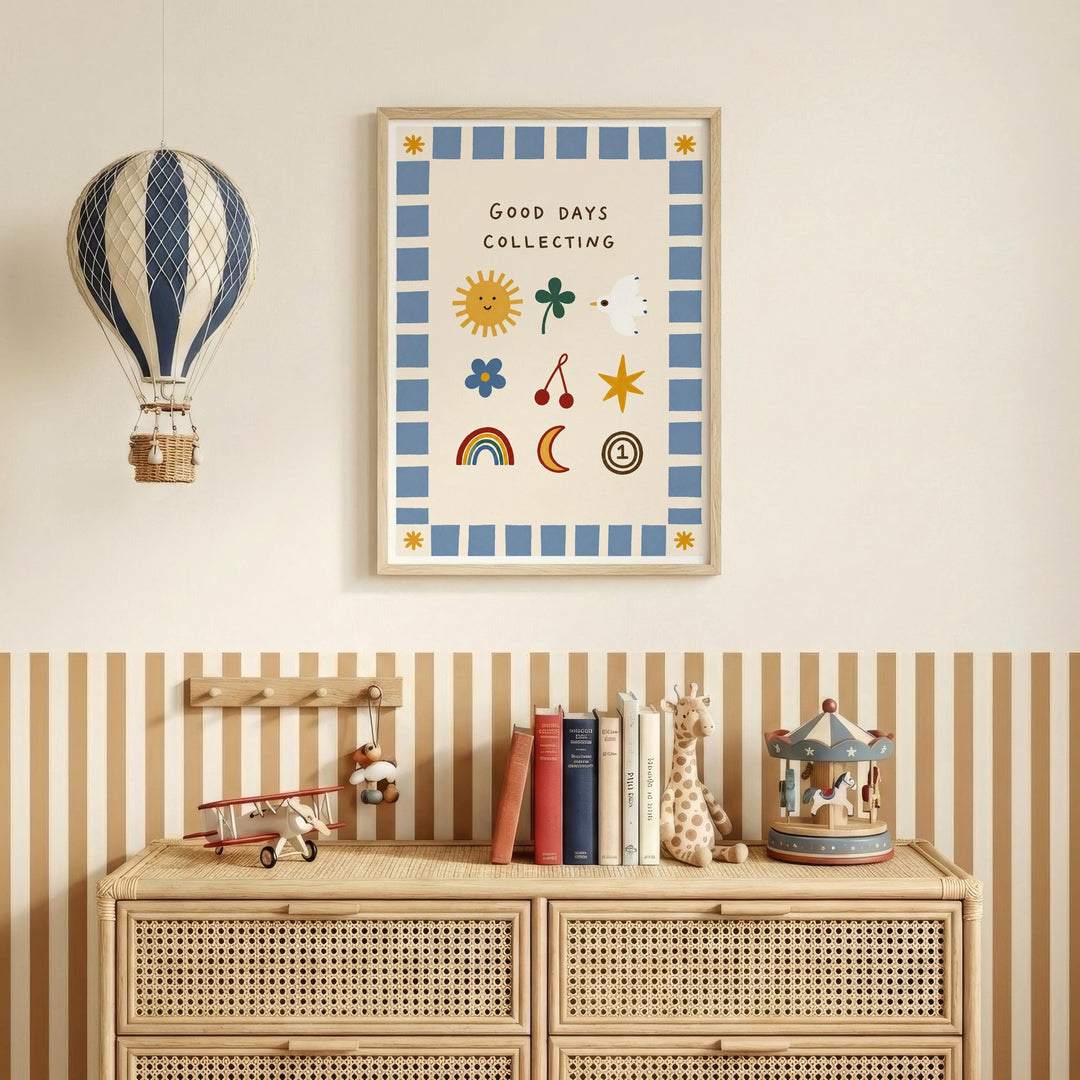 a wall with a framed poster that says "Good days collecting" above a wooden dresser with a toy airplane and a carousel.