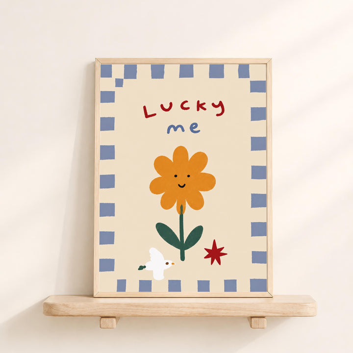 a framed illustration of a flower with the text "Lucky me" written above it.