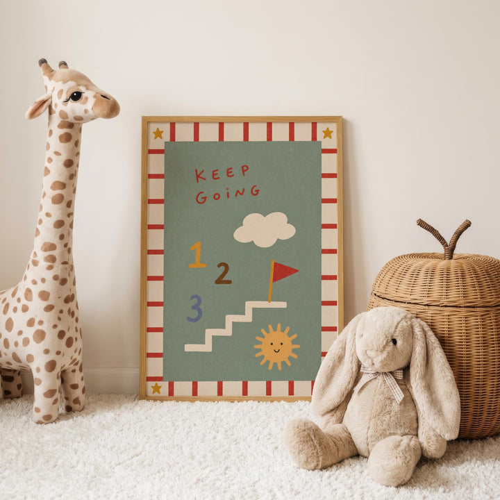 a giraffe and a stuffed rabbit sitting next to a framed poster with a motivational message.