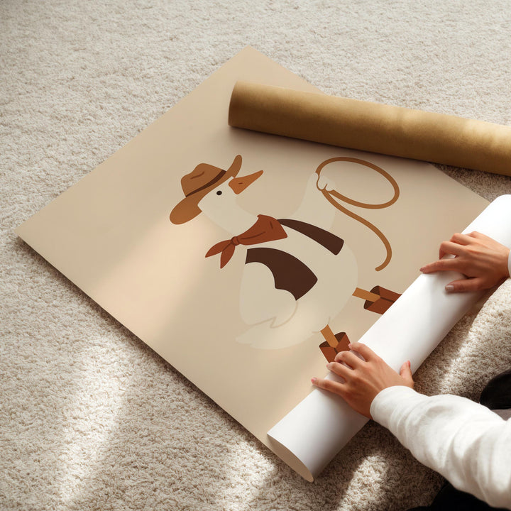 a person is holding a roll of paper with a cow on it