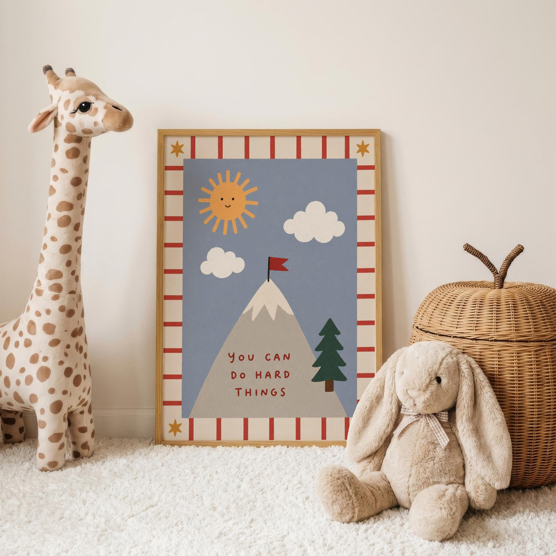 a giraffe, a poster with a mountain and clouds, and a stuffed rabbit, all arranged on a white carpet.