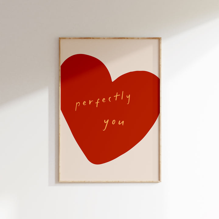a picture of a red heart on a white wall