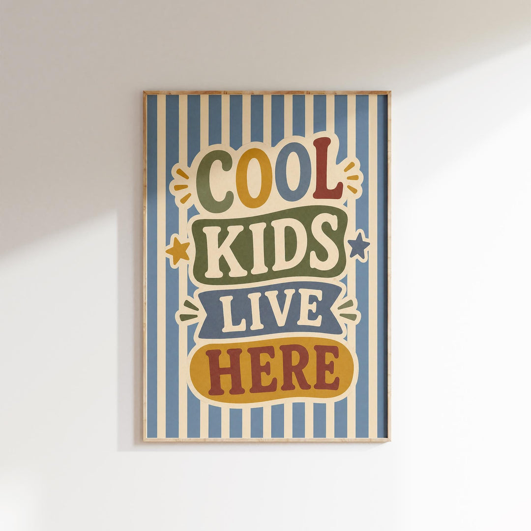 a framed poster with the text "COOL KIDS LIVE HERE" in a colorful, playful font.