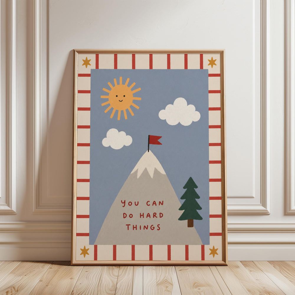 The image is a framed poster with a mountain, clouds, a flag, and a tree, along with the text "You can do hard things" written on it.