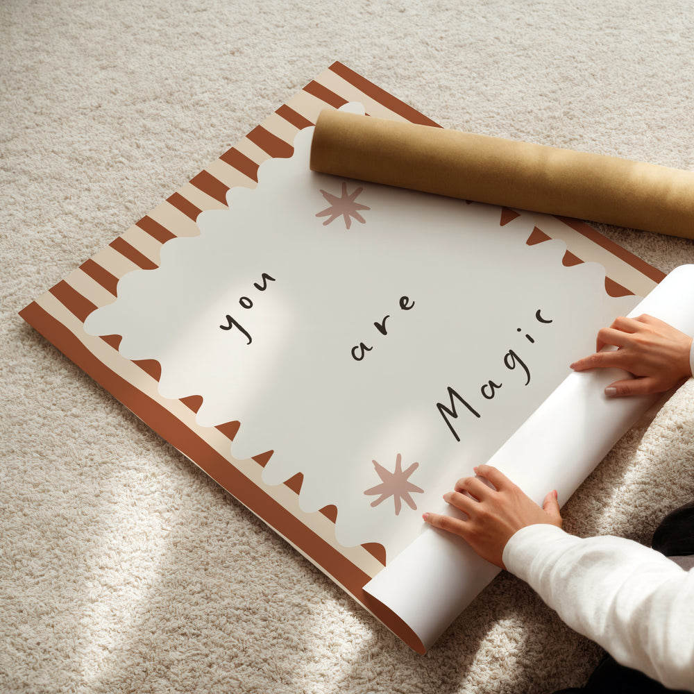 a child is holding a roll of paper with a message on it