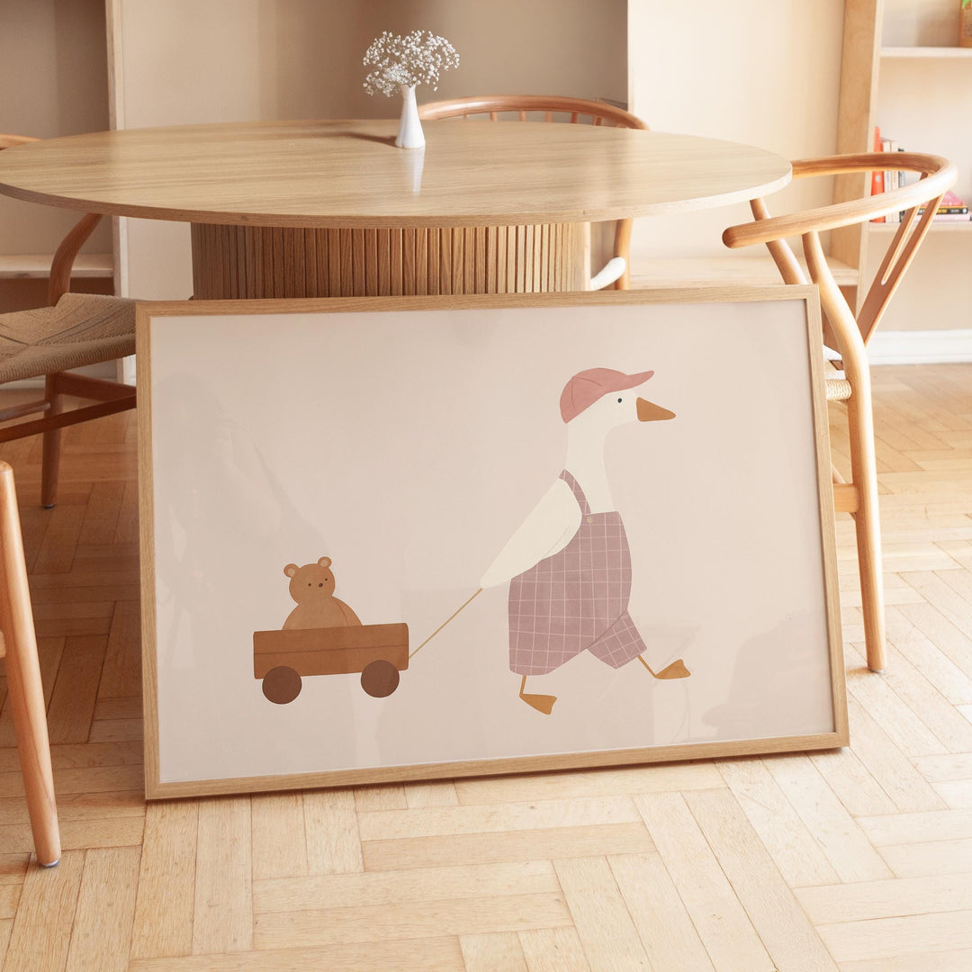 a picture of a duck pulling a teddy bear on a cart