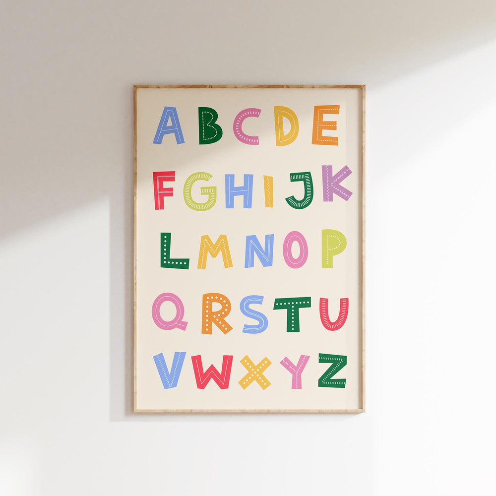 a picture of a colorful alphabet hanging on a wall