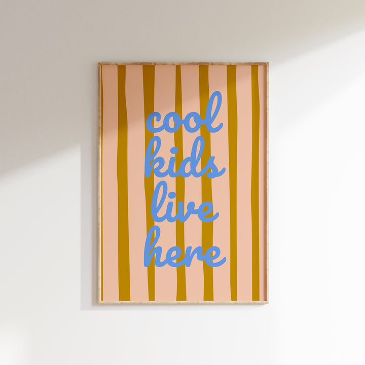 a picture hanging on a wall that says cool kids like here