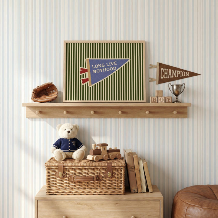 a shelf with various items, including a framed poster, a teddy bear, a baseball glove, a trophy, and a wicker basket.