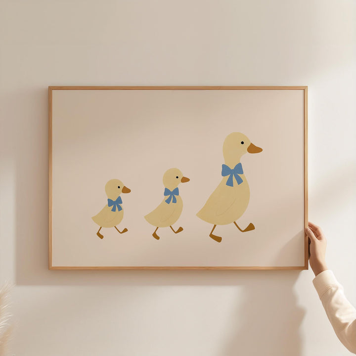 a person holding a picture of three ducks