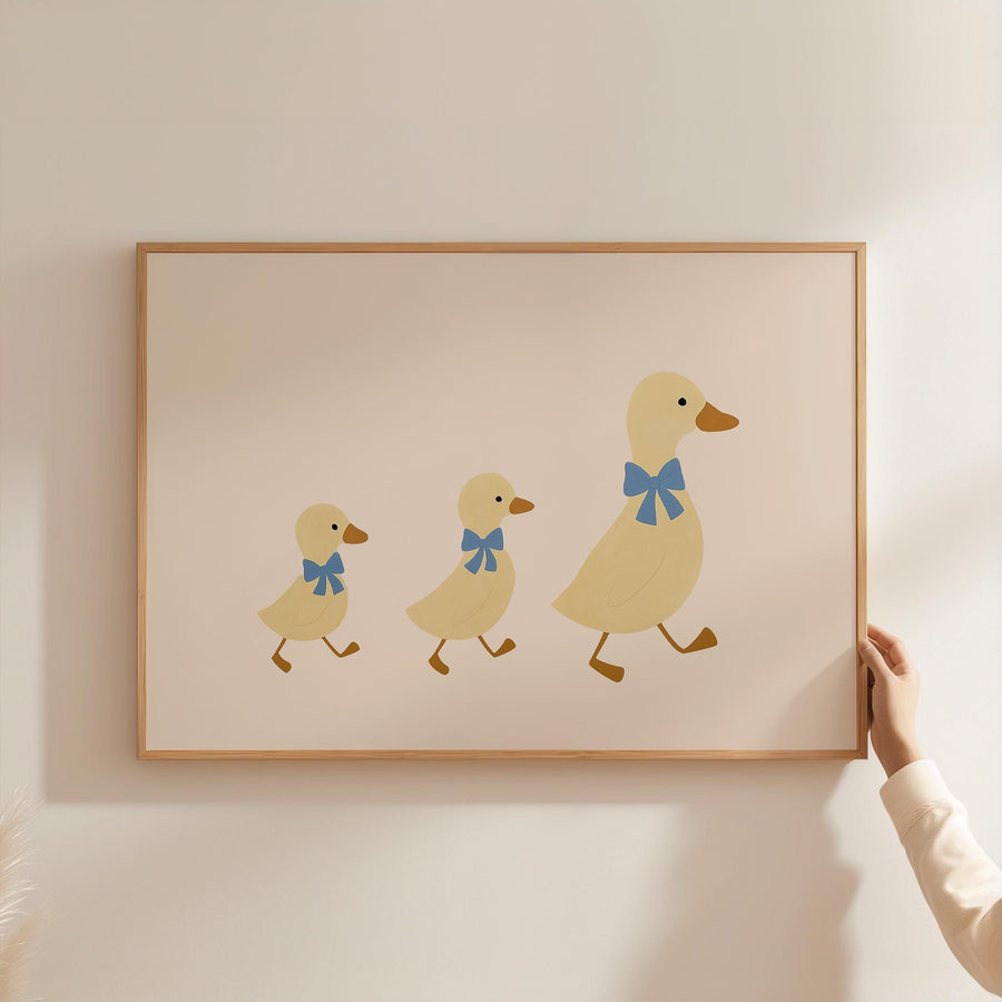 a person holding a picture of three ducks