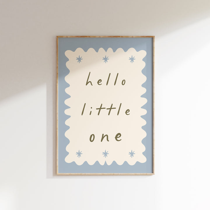 a picture of a hello little one hanging on a wall