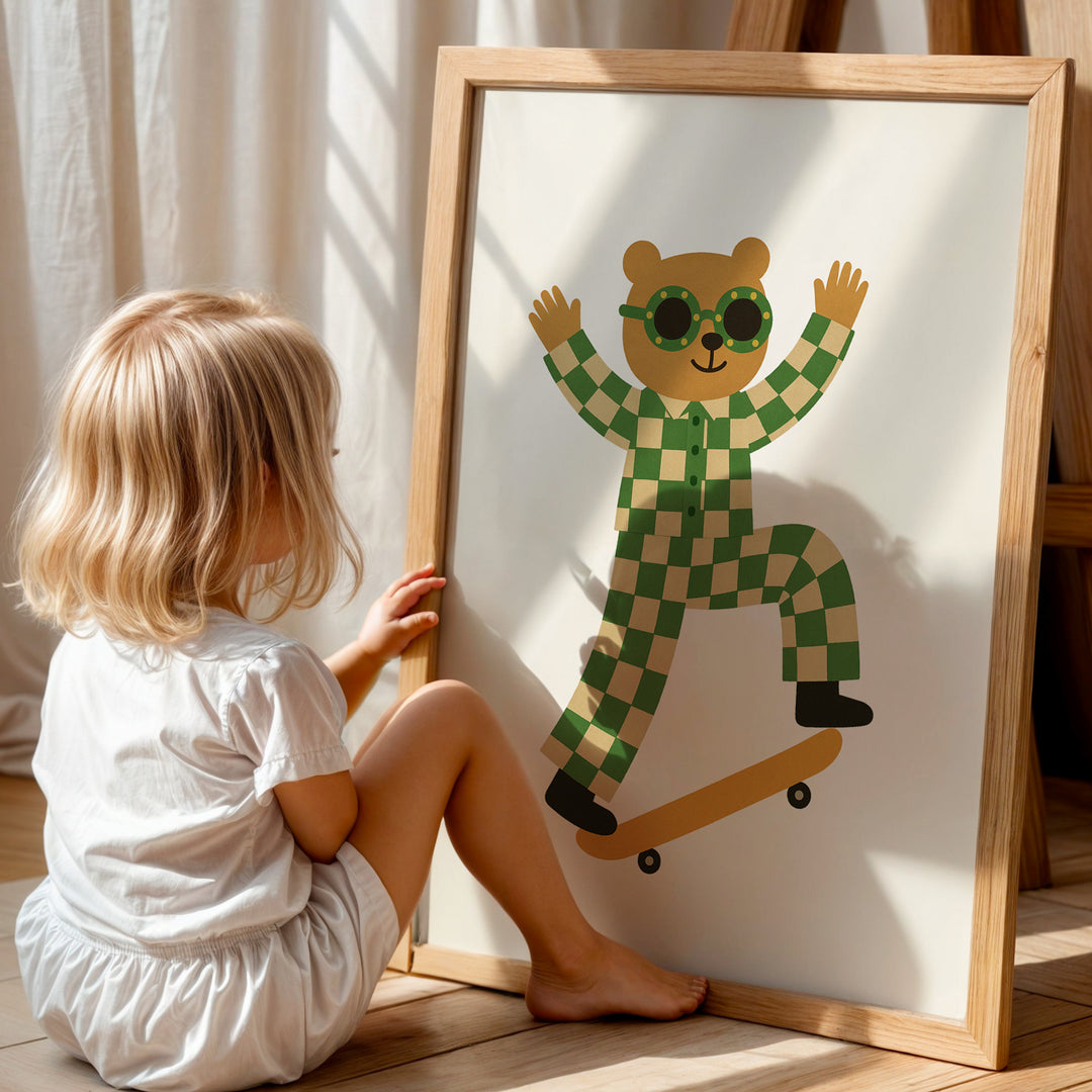 a little girl sitting next to a picture of a bear on a skateboard