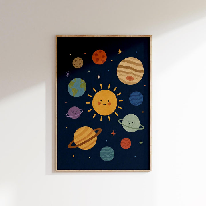 The image is a framed poster depicting a whimsical, cartoon-style depiction of the solar system, with planets and stars arranged in a playful, imaginative manner.