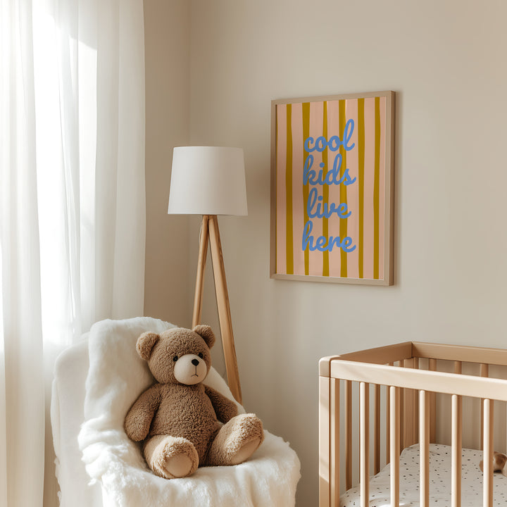 a teddy bear sitting in a chair next to a crib
