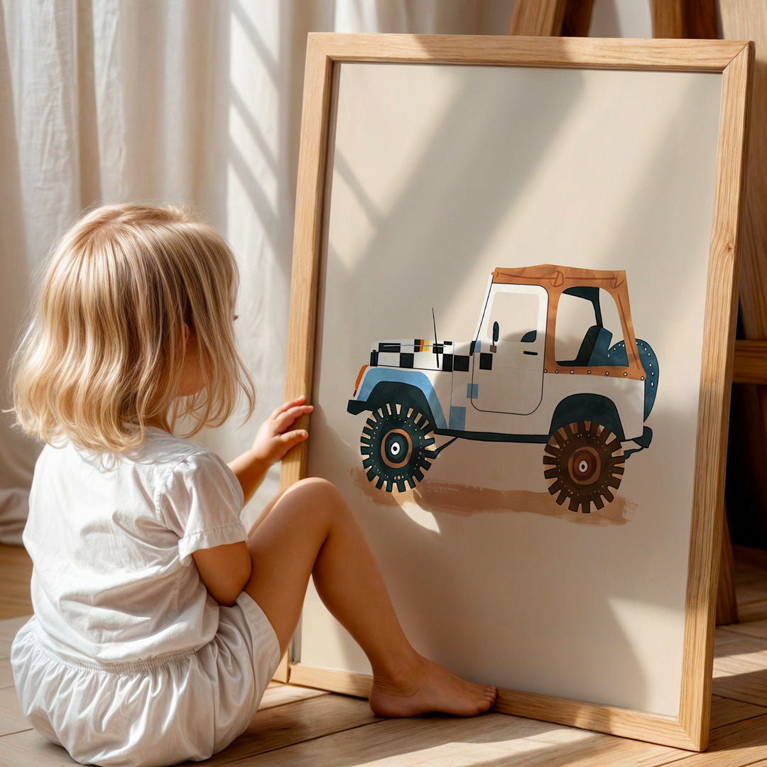 a little girl sitting on the floor next to a painting