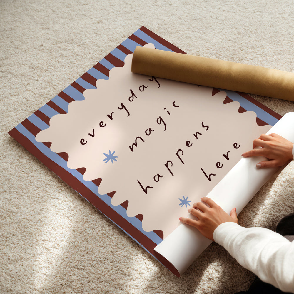a child is holding a rolled up sign