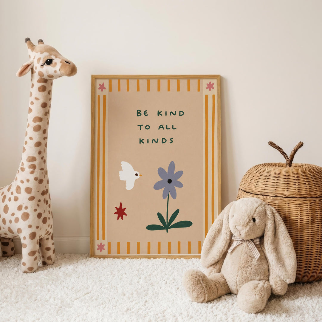 a giraffe, a rabbit, and a wicker basket, all placed on a white carpet. In the background, there is a framed poster with the text "Be kind to all kinds" and illustrations of a bird, a flower, and a star.