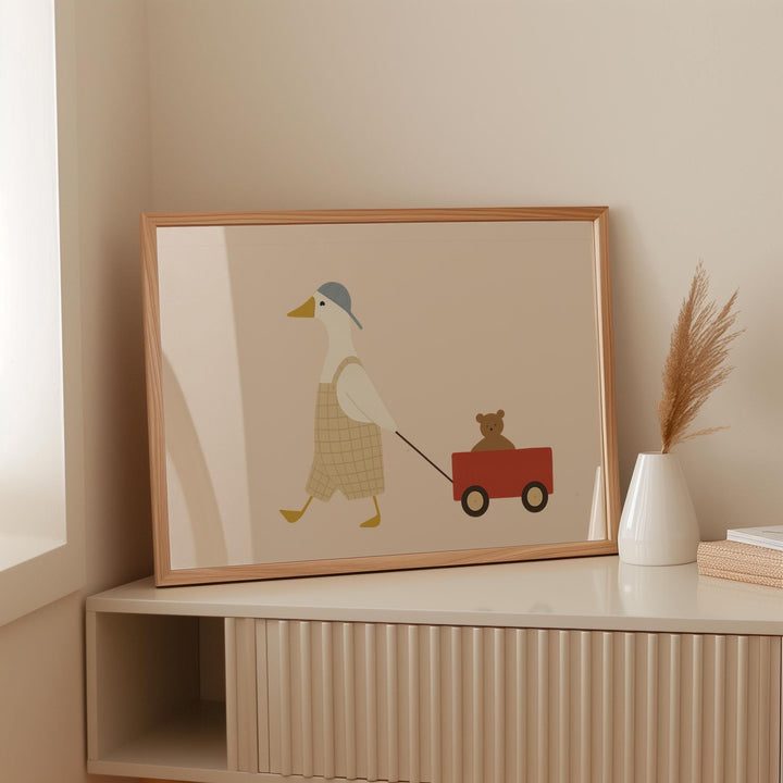 a picture of a duck pulling a bear on a wagon