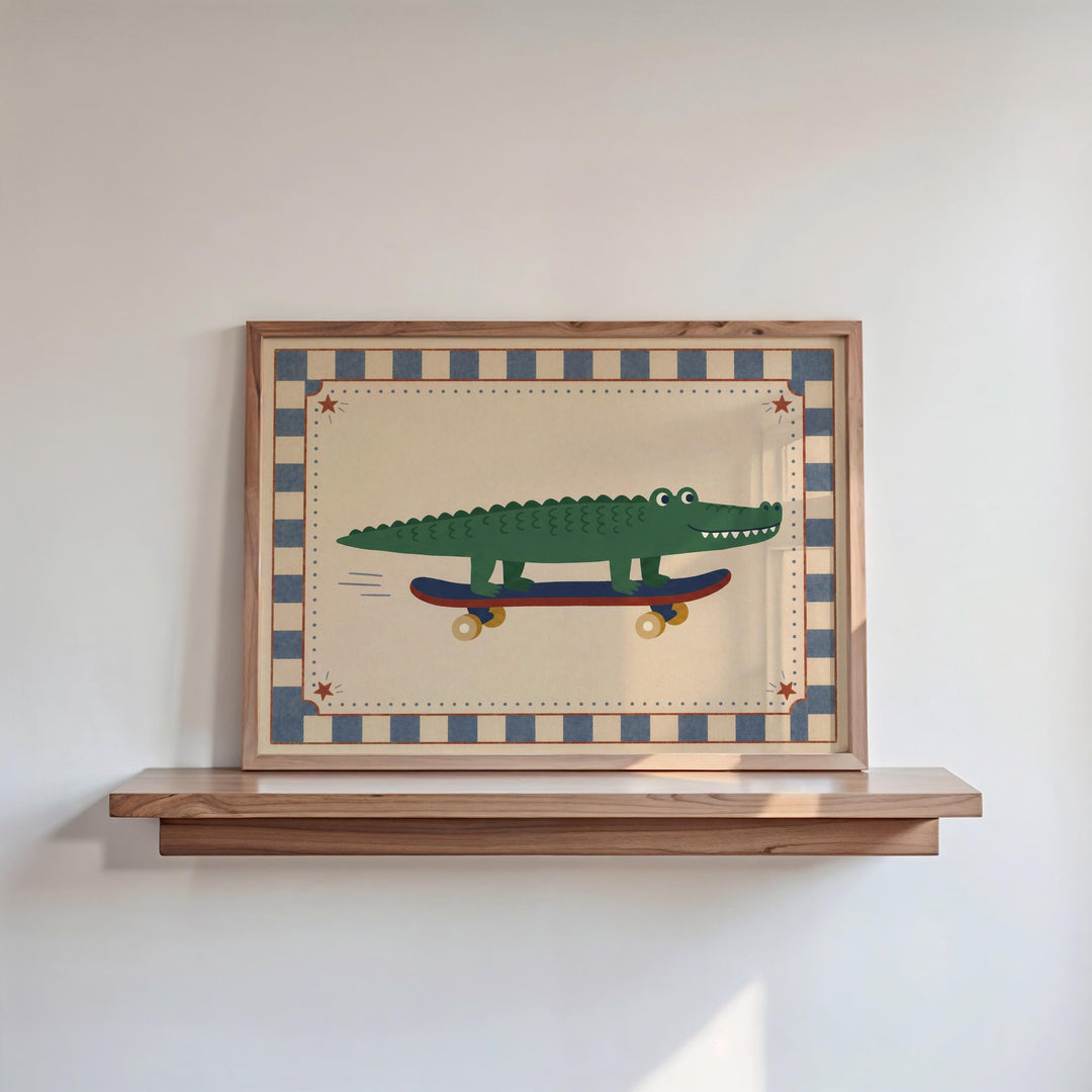 A framed picture of a green alligator riding a skateboard is displayed on a wooden shelf against a white wall.