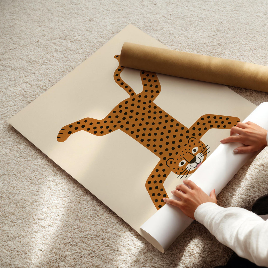 a person holding a roll of paper with a picture of a cat on it