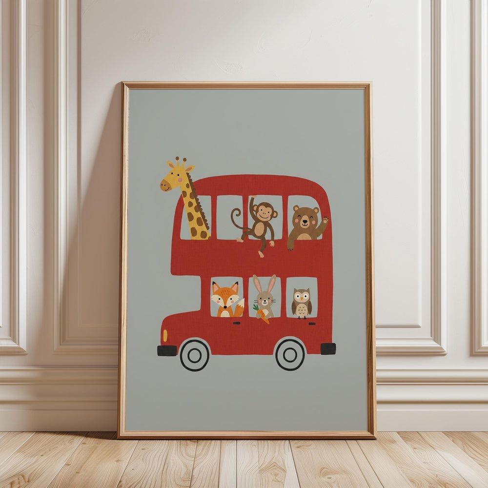 A framed illustration of a red double-decker bus with various cartoon animal characters, including a giraffe, monkey, bear, fox, rabbit, and owl, on its top.
